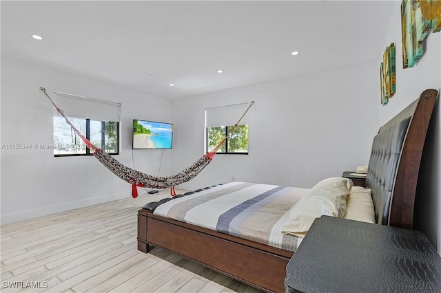 bedroom with light hardwood / wood-style flooring