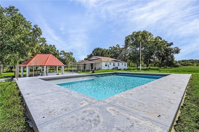 view of pool with a gazebo, a lawn, and a patio