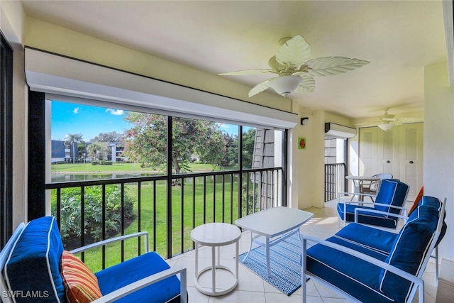 sunroom / solarium with ceiling fan and a wall unit AC