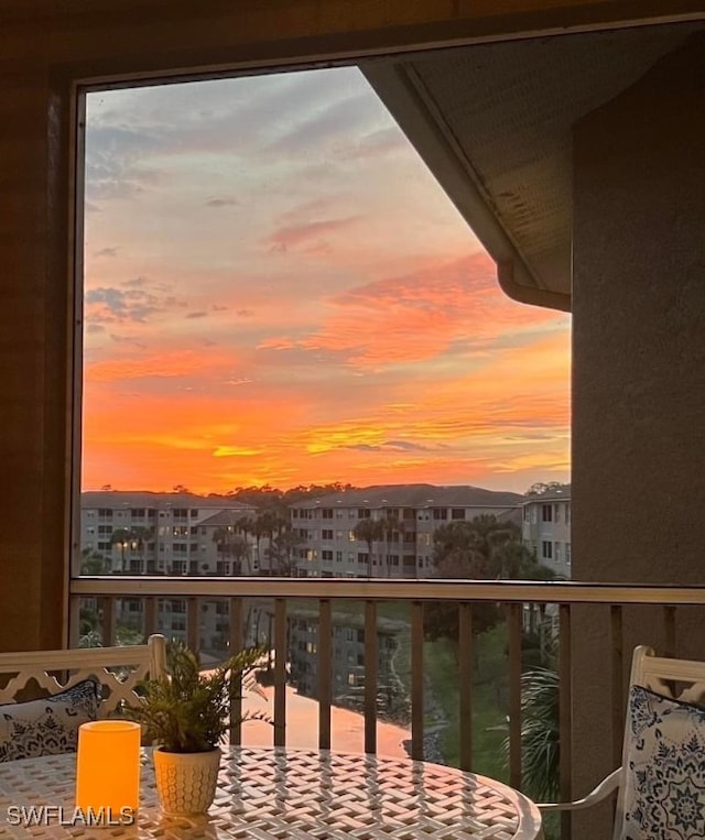 view of balcony at dusk