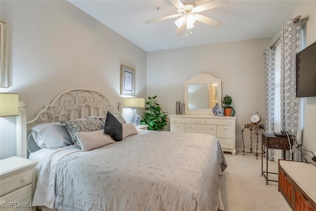 bedroom featuring ceiling fan and light colored carpet