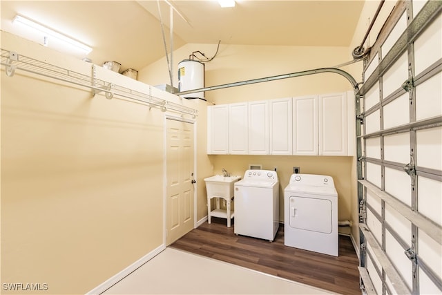 laundry room with cabinets, separate washer and dryer, sink, and dark wood-type flooring