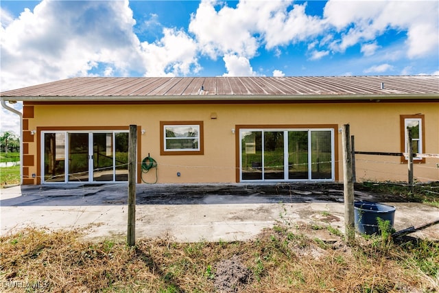 rear view of house featuring a patio