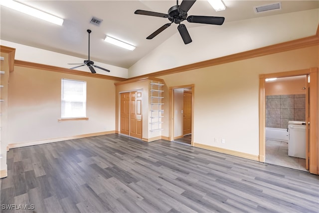 interior space featuring ensuite bathroom, ceiling fan, light wood-type flooring, and vaulted ceiling