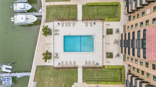 birds eye view of property with a water view