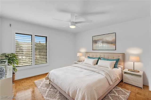 bedroom featuring light parquet floors and ceiling fan