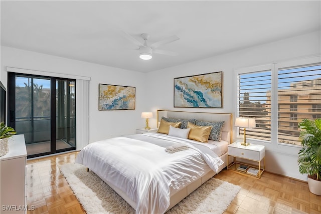 bedroom featuring ceiling fan, light parquet floors, and access to exterior