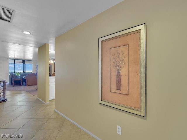 corridor with light tile patterned flooring