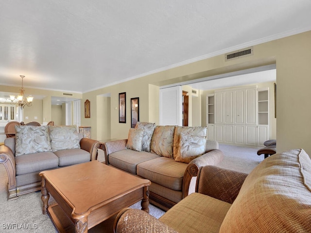 living room featuring light carpet, ornamental molding, and an inviting chandelier