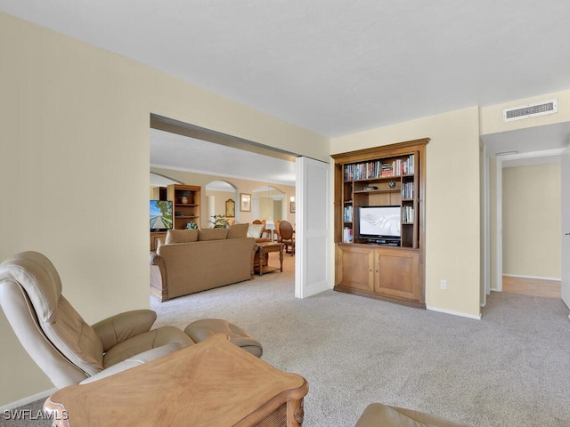 5260 S Landings Dr Unit 805, Fort Myers, FL 33919 - living area featuring light colored carpet, arched walkways, visible vents, and baseboards
