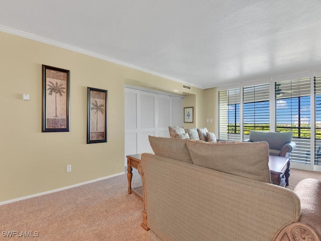 carpeted living room with crown molding