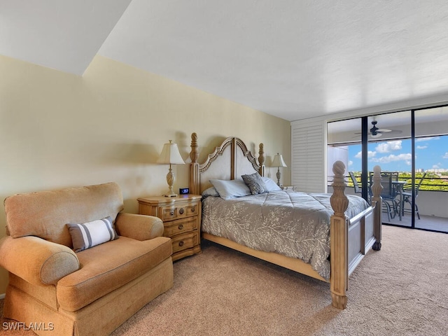 carpeted bedroom with expansive windows and access to exterior