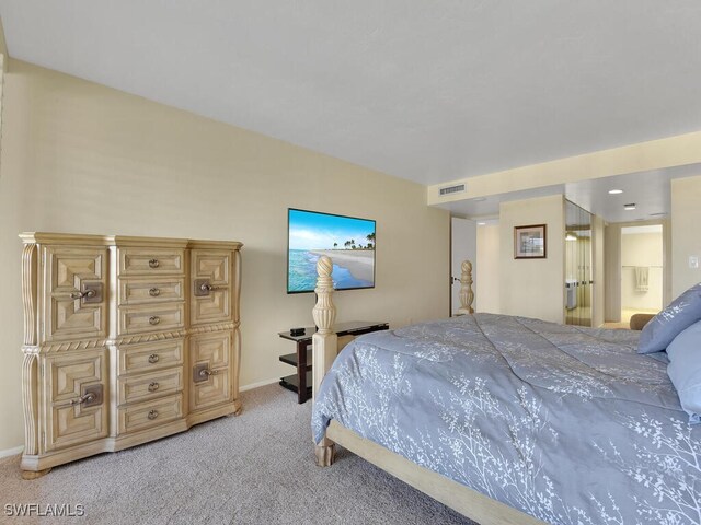 5260 S Landings Dr Unit 805, Fort Myers, FL 33919 - bedroom with baseboards, light carpet, connected bathroom, and visible vents