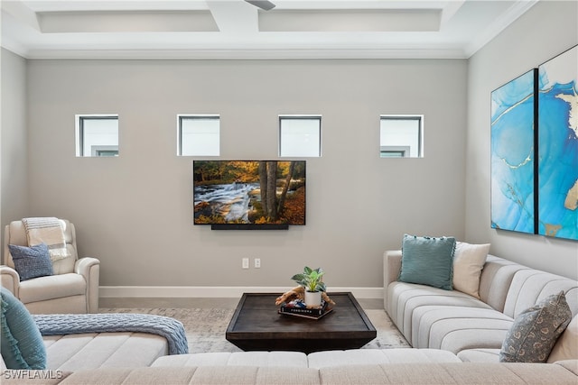 living room with ornamental molding and a healthy amount of sunlight