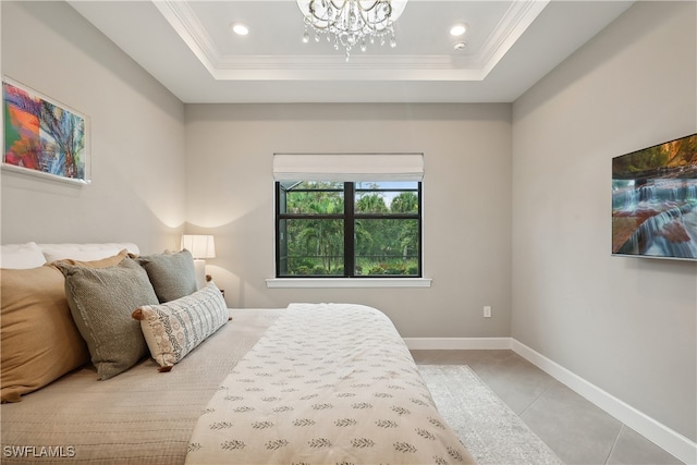 bedroom featuring a notable chandelier, a tray ceiling, crown molding, and light tile patterned floors