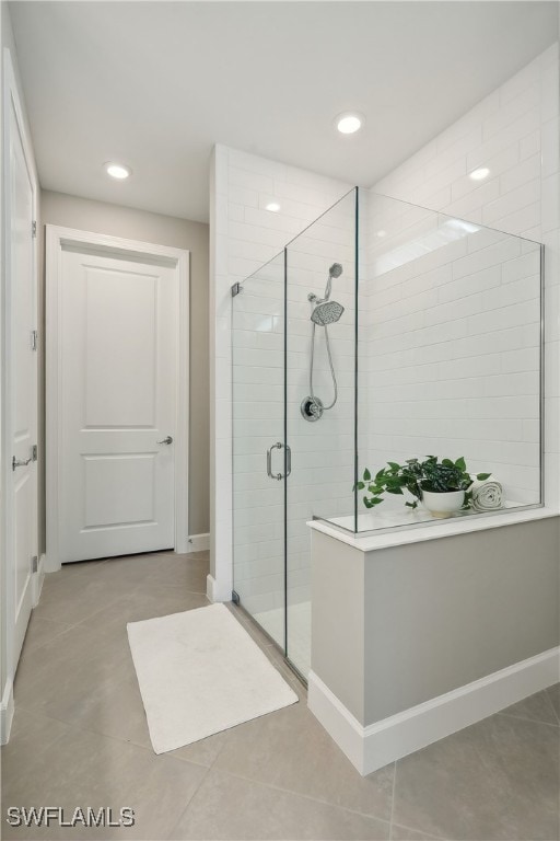 bathroom with a shower with shower door