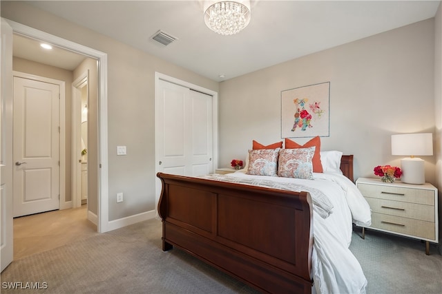 carpeted bedroom featuring a closet