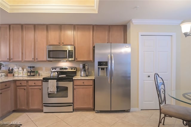 kitchen featuring stainless steel appliances, crown molding, light stone counters, and light tile patterned floors