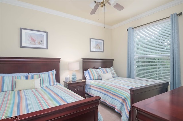 bedroom with ceiling fan, crown molding, and carpet flooring