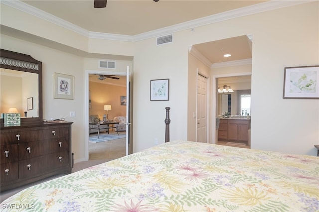 bedroom with light tile patterned flooring, ornamental molding, connected bathroom, and ceiling fan