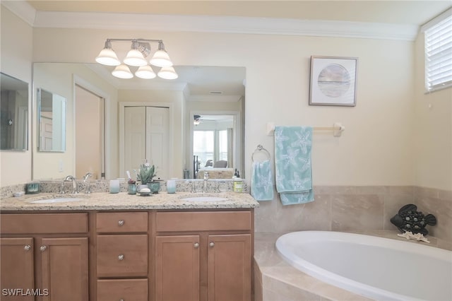 10296 Heritage Bay Blvd Unit 3111, Naples, FL 34120 - bathroom with a garden tub, crown molding, double vanity, and a sink
