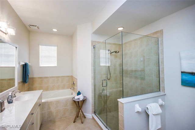 bathroom featuring tile patterned floors, vanity, and independent shower and bath