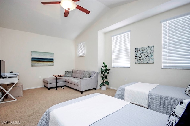 carpeted bedroom with vaulted ceiling, multiple windows, and ceiling fan