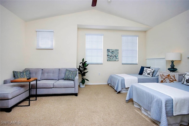 carpeted bedroom featuring lofted ceiling, multiple windows, and ceiling fan