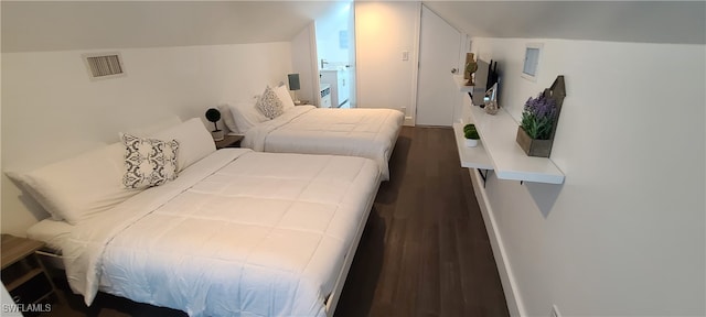 bedroom featuring dark hardwood / wood-style flooring