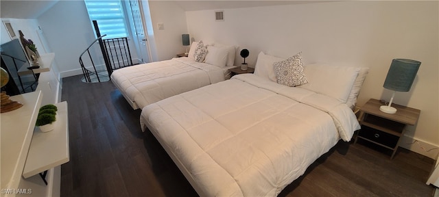 bedroom featuring dark hardwood / wood-style flooring