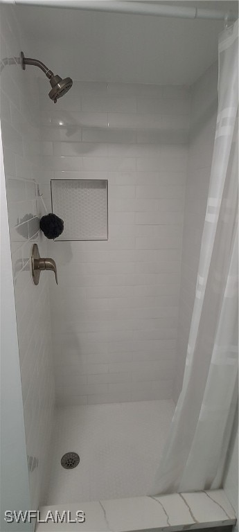 bathroom with a shower with shower curtain