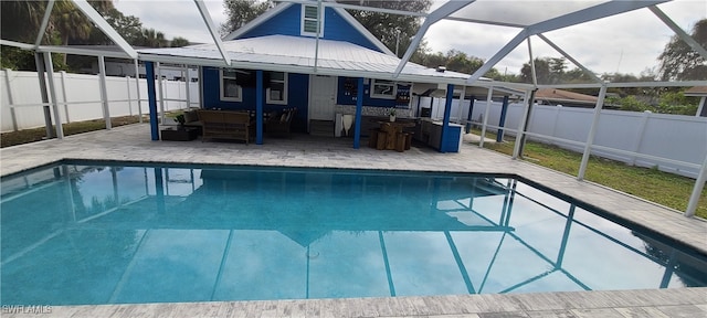 view of pool featuring a lanai and a patio area