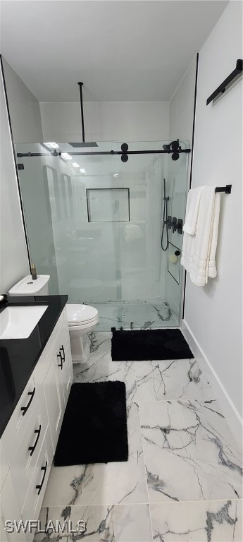 bathroom featuring toilet, walk in shower, and vanity