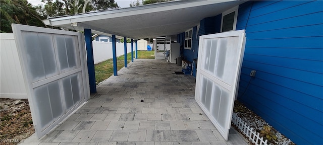 view of patio featuring a carport