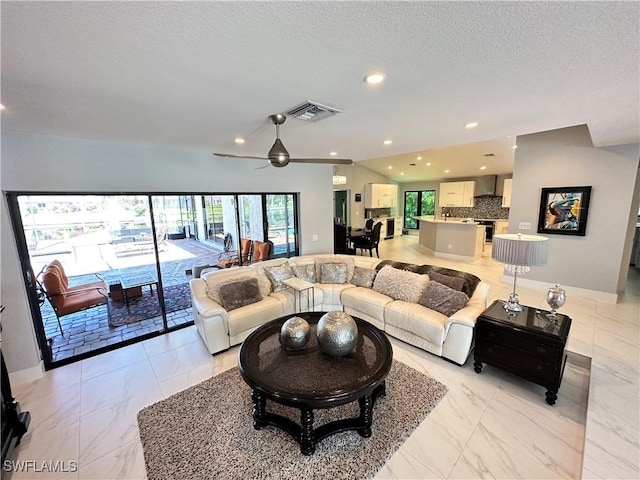 living room with a textured ceiling