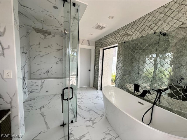 bathroom featuring tile walls and plus walk in shower