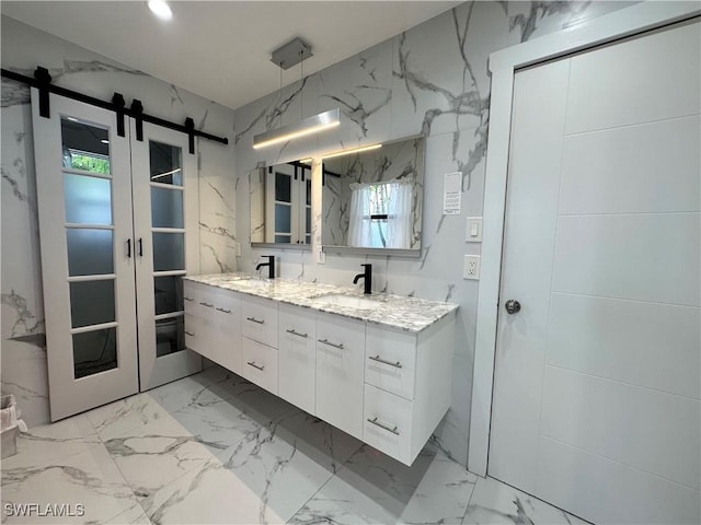 bathroom featuring a wealth of natural light and vanity