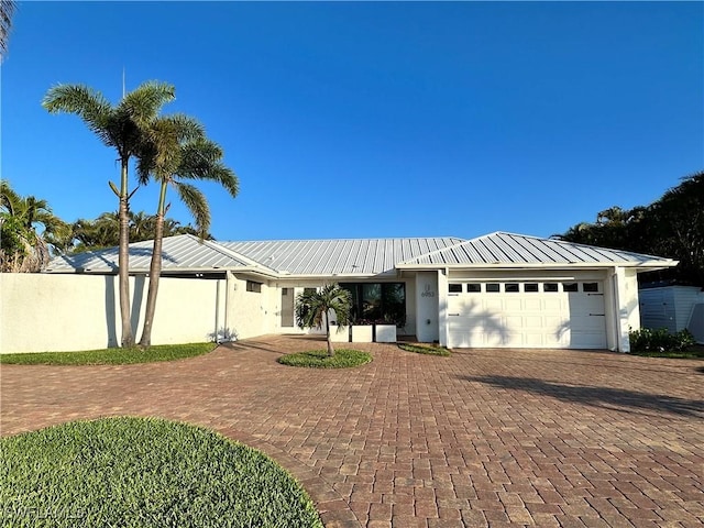 single story home with a garage