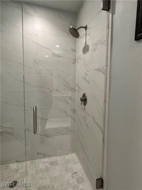 bathroom with an enclosed shower