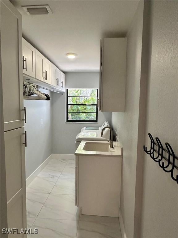 interior space featuring cabinets and sink