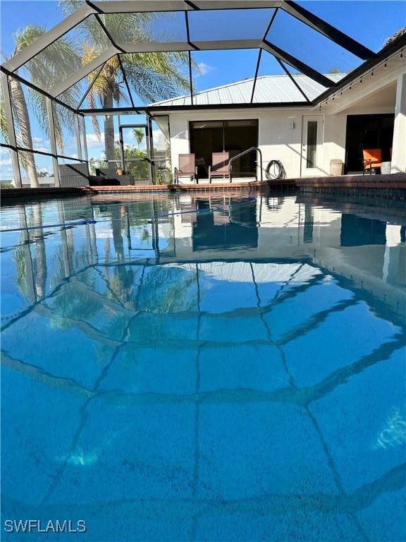 view of swimming pool with a lanai