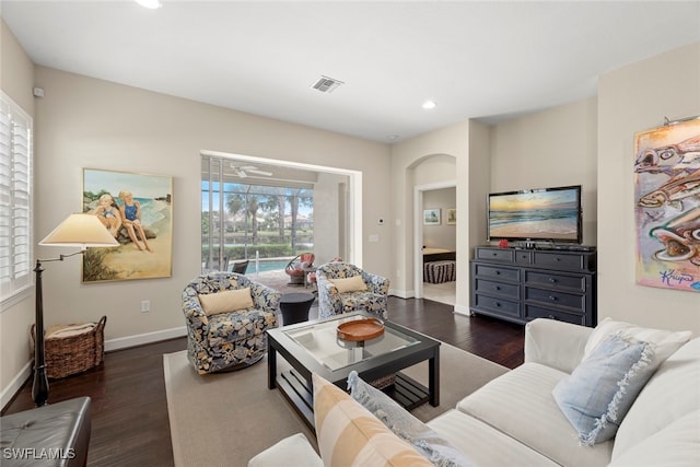 living room with dark hardwood / wood-style floors