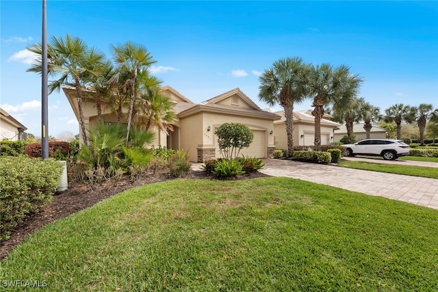 view of front of property with a garage and a front lawn