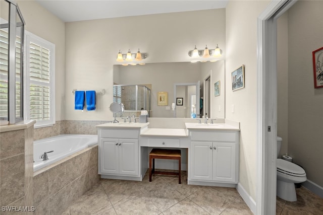 full bathroom featuring vanity, tile patterned flooring, toilet, and plus walk in shower