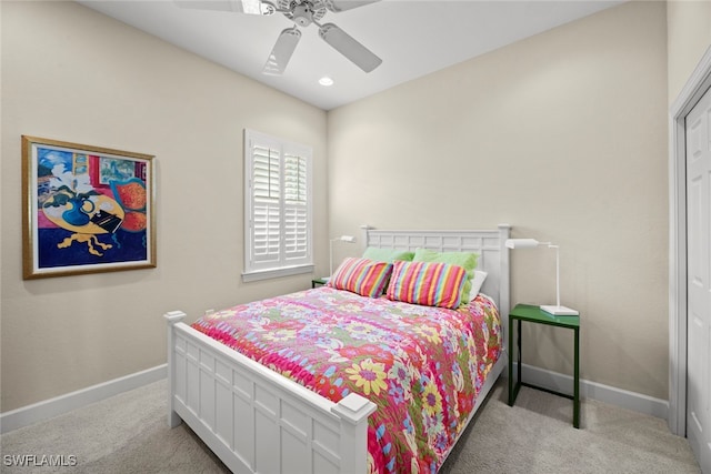 carpeted bedroom with ceiling fan