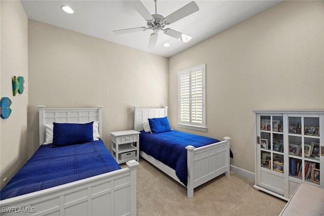 bedroom featuring ceiling fan and light colored carpet