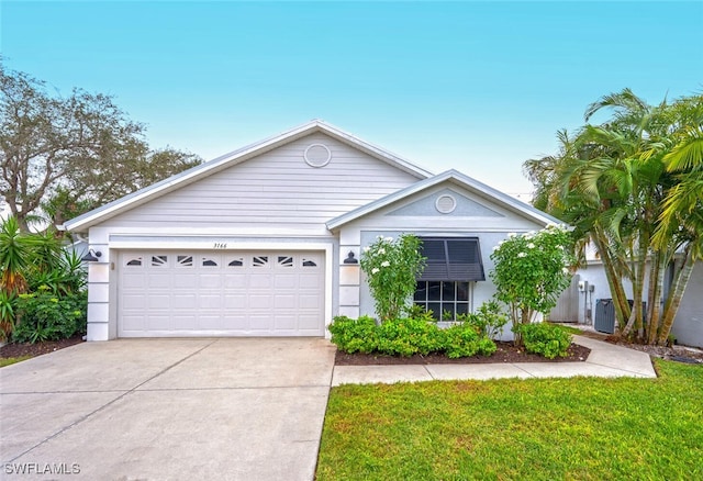 ranch-style house featuring a garage, concrete driveway, and a front yard