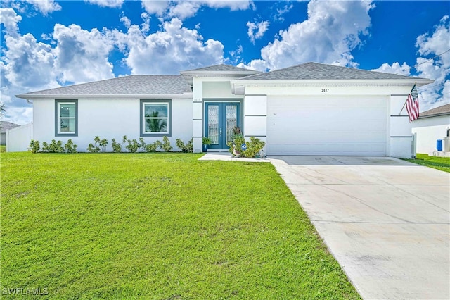 single story home featuring a garage and a front lawn