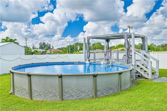 view of pool featuring a lawn