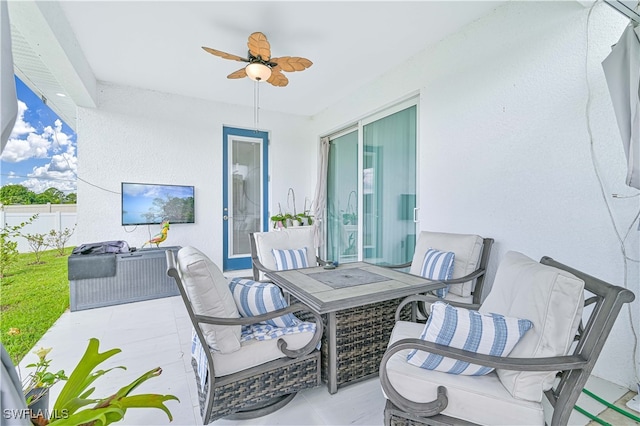 view of patio / terrace featuring ceiling fan